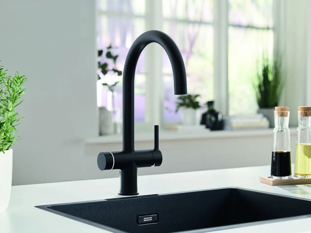 Franke Maris Water Hub 3-in-1 electronic boiling water tap in matt black, with the LED control ring lit
