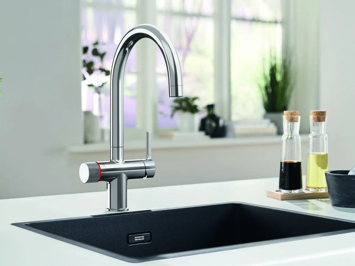 Franke Maris Water Hub 3-in-1 mechanical boiling water tap in chrome at a black undermount sink